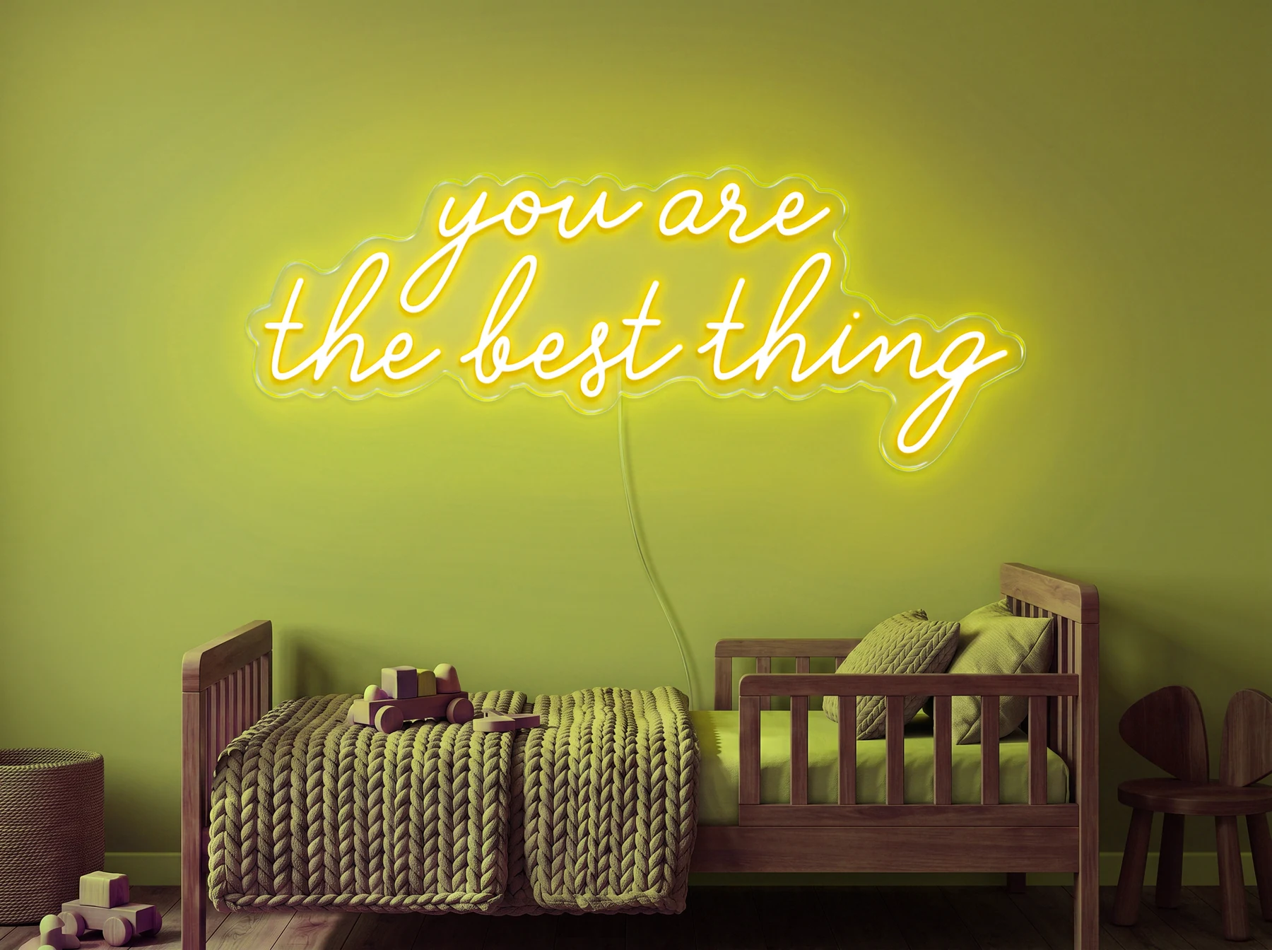 Neonskylt «You Are The Best Thing» i gul LED-neon, monterad på vägg