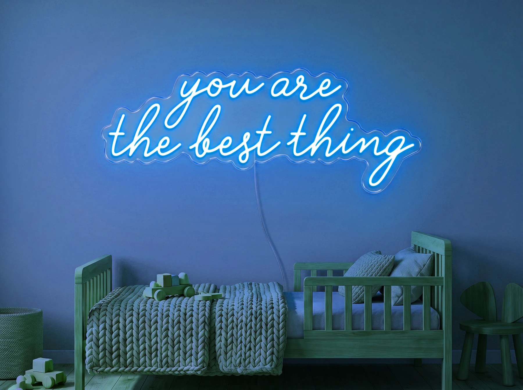 Neonskylt «You Are The Best Thing» i isblå LED-neon, monterad på vägg