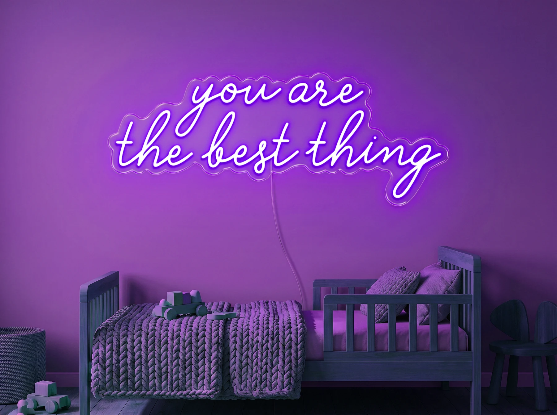 Neonskylt «You Are The Best Thing» i lila LED-neon, monterad på vägg