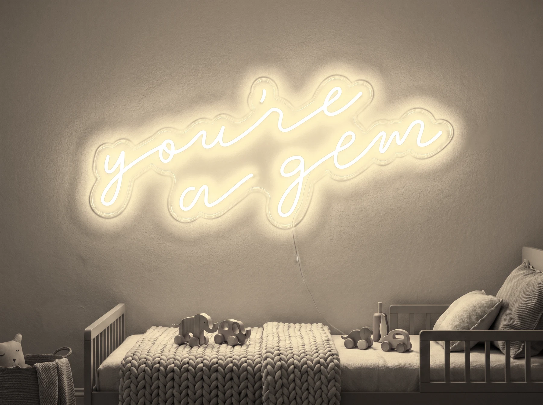 Neonskylt «You’re A Gem» i varmvit LED-neon, monterad på vägg