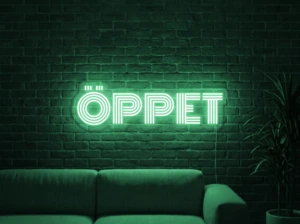 Neonskylt «ÖPPET» i mintgrön LED-neon, monterad på vägg